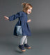 Betsy (age 2) jumping in our KIDLY Label Denim Pocket Dress